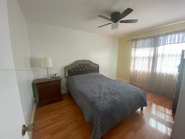 4046 Eastridge Dr, Deerfield Beach, FL 33064 - bedroom with a ceiling fan and wood finished floors