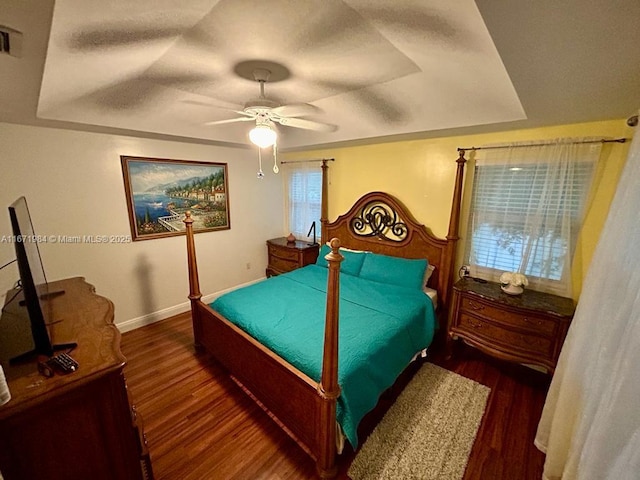 4046 Eastridge Dr, Deerfield Beach, FL 33064 - bedroom with baseboards, a tray ceiling, wood finished floors, a textured ceiling, and a ceiling fan