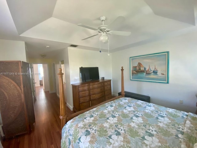 4046 Eastridge Dr, Deerfield Beach, FL 33064 - bedroom with visible vents, ceiling fan, baseboards, a tray ceiling, and wood finished floors