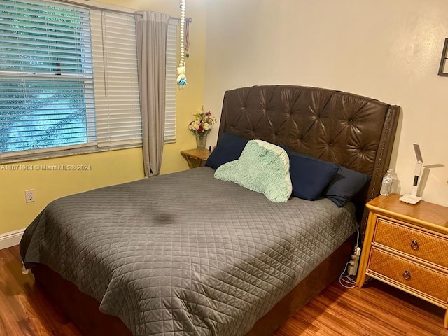 bedroom featuring wood-type flooring