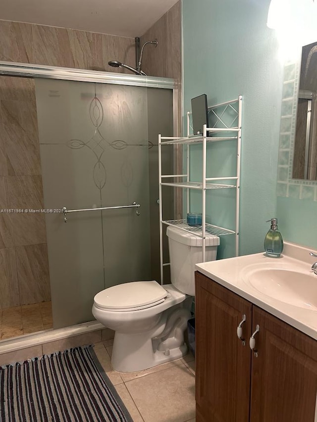 4046 Eastridge Dr, Deerfield Beach, FL 33064 - bathroom with tile patterned floors, a stall shower, toilet, and vanity