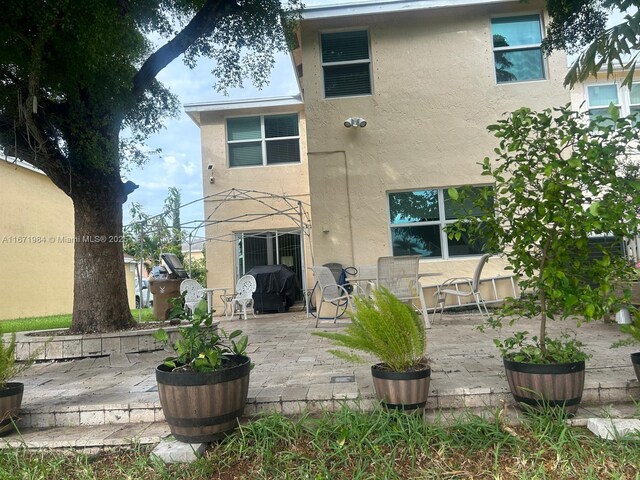 rear view of house with a patio area