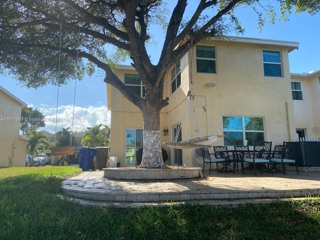 4046 Eastridge Dr, Deerfield Beach, FL 33064 - rear view of property with a patio and stucco siding