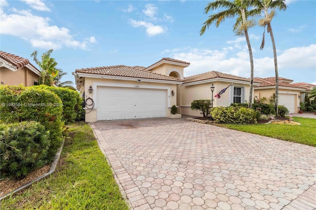 mediterranean / spanish-style home featuring a garage