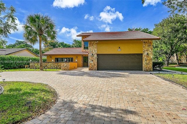 view of front of property featuring a garage