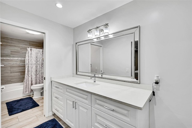 full bathroom with vanity, toilet, and shower / bath combo