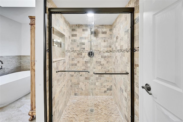 bathroom featuring independent shower and bath and tile walls