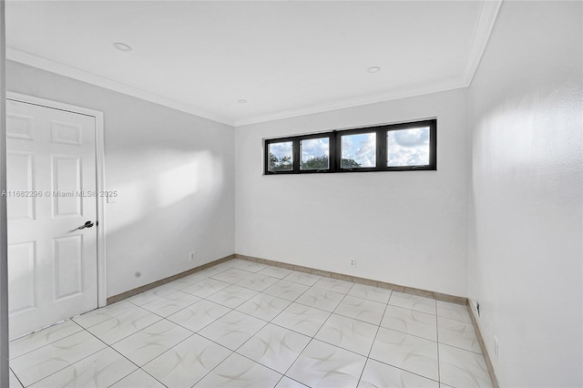 spare room featuring crown molding