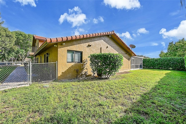 view of home's exterior featuring a yard