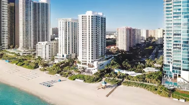 city view featuring a view of the beach and a water view