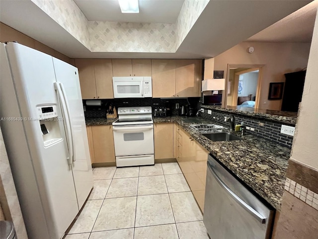 kitchen featuring light brown cabinets, white appliances, backsplash, sink, and light tile patterned floors