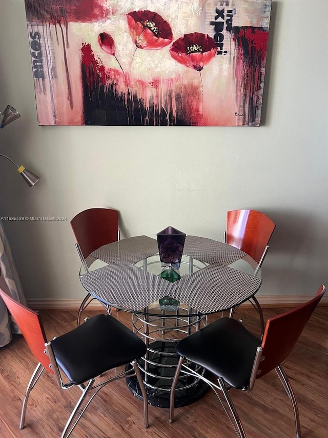 dining room with hardwood / wood-style floors