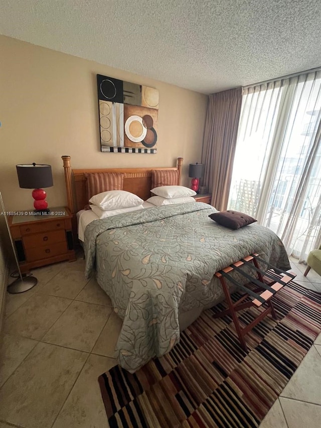 tiled bedroom with a textured ceiling