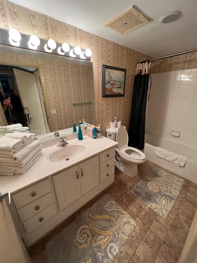 full bathroom with tile patterned flooring, vanity, toilet, and shower / bath combo with shower curtain