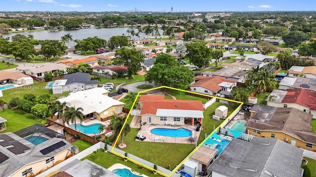 birds eye view of property featuring a water view