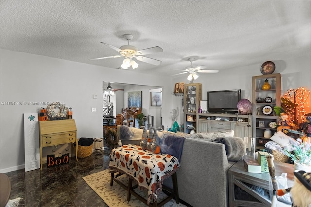 living room with a textured ceiling and ceiling fan