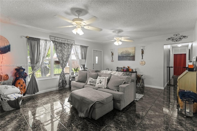 living room featuring a textured ceiling and ceiling fan