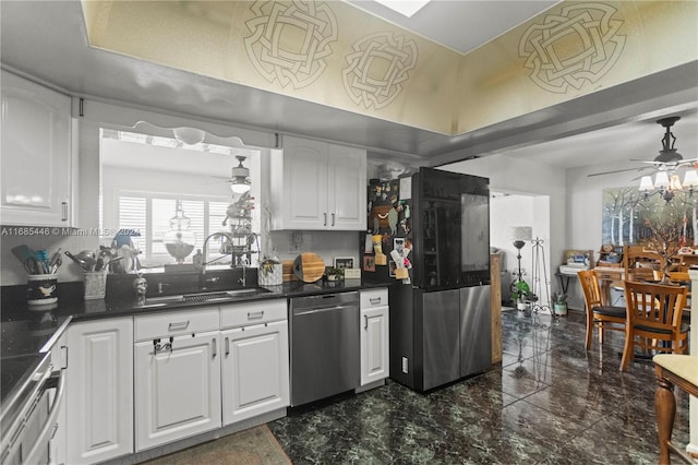 kitchen with sink, white cabinetry, stainless steel appliances, and ceiling fan