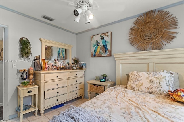 tiled bedroom featuring ceiling fan and ornamental molding