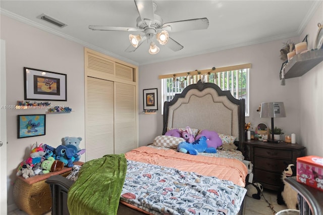 bedroom with a closet, ceiling fan, and crown molding