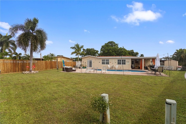 exterior space with a patio area and a fenced in pool