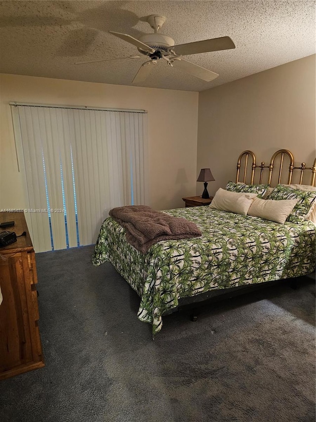 carpeted bedroom with ceiling fan and a textured ceiling