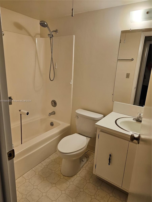 full bathroom with vanity, toilet, and washtub / shower combination