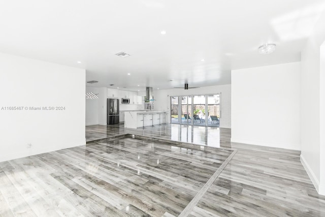 unfurnished living room featuring light hardwood / wood-style floors