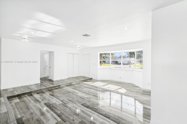 unfurnished room with light wood-type flooring