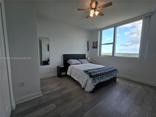 bedroom featuring ceiling fan and dark hardwood / wood-style floors