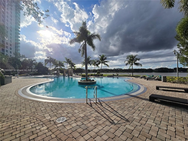 view of swimming pool featuring a patio area