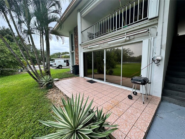 view of patio with a balcony and grilling area