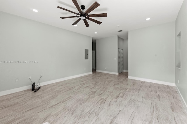 spare room with recessed lighting, electric panel, visible vents, and baseboards