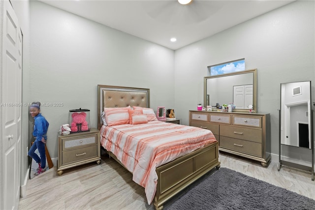 bedroom featuring recessed lighting, a ceiling fan, visible vents, baseboards, and light wood-type flooring