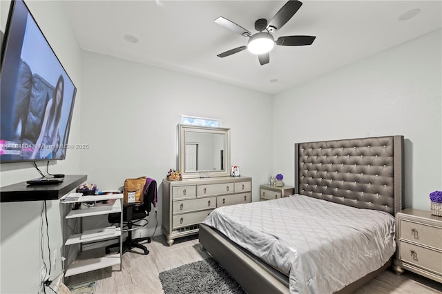 bedroom with ceiling fan and wood finished floors