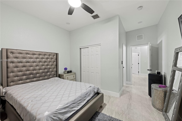 bedroom featuring a ceiling fan, baseboards, visible vents, and a closet