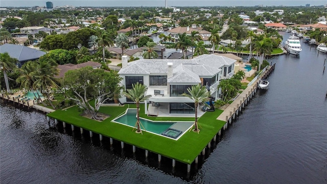 birds eye view of property with a water view