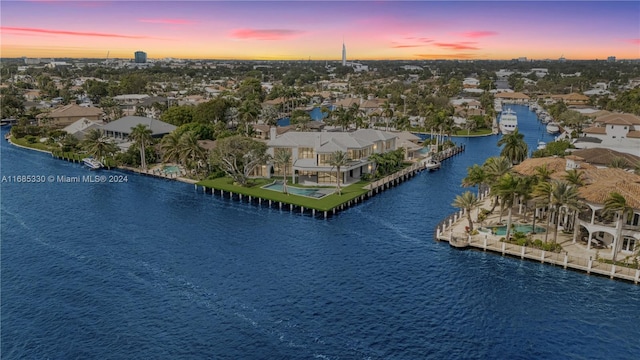 aerial view at dusk with a water view