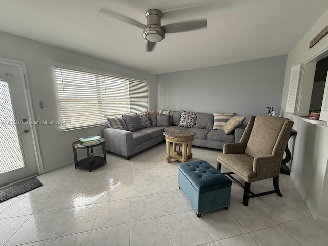 living room with light tile patterned floors and ceiling fan