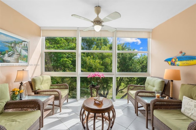 sunroom / solarium featuring ceiling fan