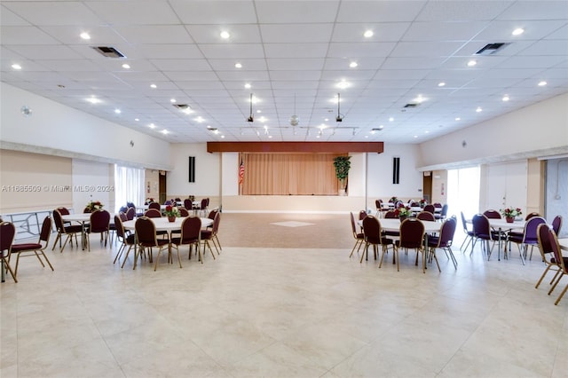 dining area with a paneled ceiling