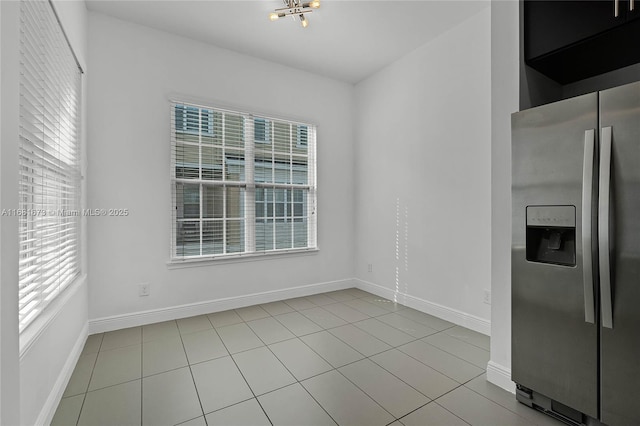 unfurnished dining area with light tile patterned floors