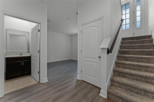 staircase featuring hardwood / wood-style floors