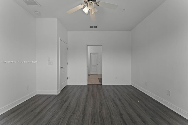 unfurnished room featuring ceiling fan and dark hardwood / wood-style flooring