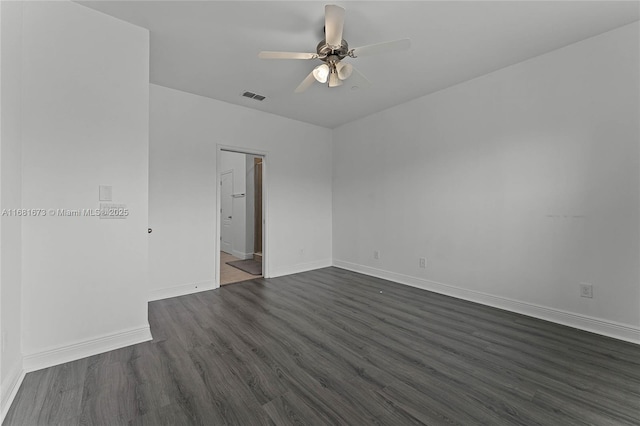 empty room with dark wood-type flooring and ceiling fan