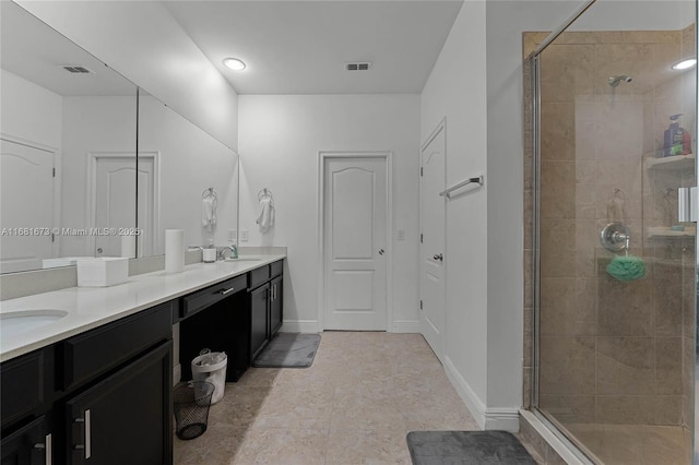 bathroom with vanity and an enclosed shower