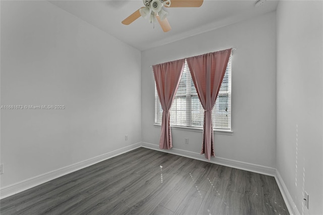 unfurnished room featuring dark wood-type flooring and ceiling fan