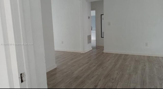 spare room featuring hardwood / wood-style flooring