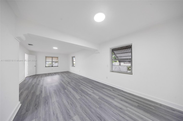 unfurnished room with wood-type flooring