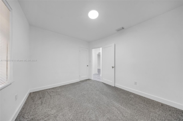 unfurnished room with carpet floors